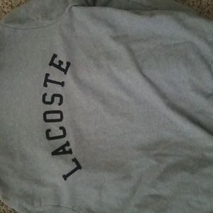 Lacoste Zip up sweate. Brand new condition, size XL. Grey outside black inside